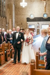 Bride walking down aisle in wedding in St. Patrick's Church in Philadelphia