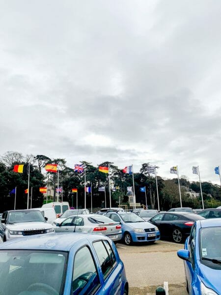 Parking lot with international flags in Pornic, France