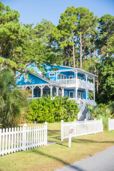 Bright blue beach house with white picket fence on Daufuskie Island