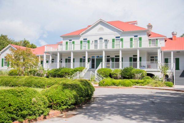 White house with green shutters and light red roof on Daufuskie Island