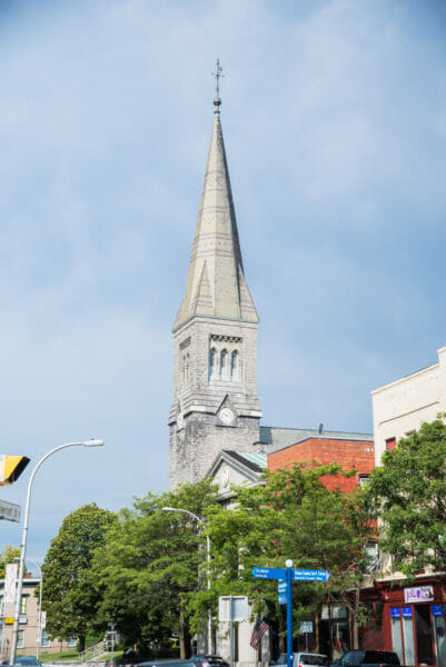 Stone church with tall tower in Plattsburgh, NY