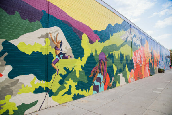 Colorful mural of women hiking in Burlington, VT