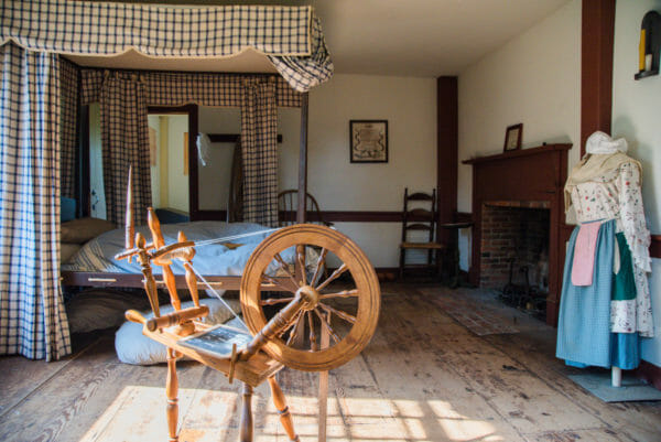 Bedroom with spinning wheel in Ethan Allen home