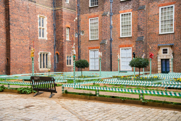 Renaissance style garden with green and white striped poles