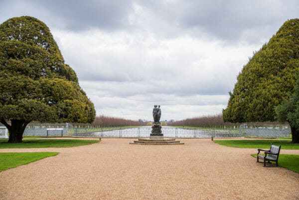 Hampton Court garden with statue in front of a pond