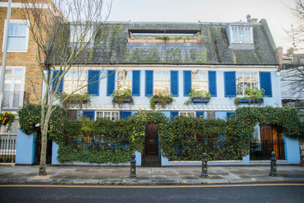 Blue house with dark blue shutters in Notting Hill