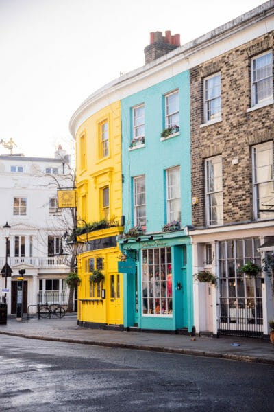 Teal and yellow curved building in Notting Hill