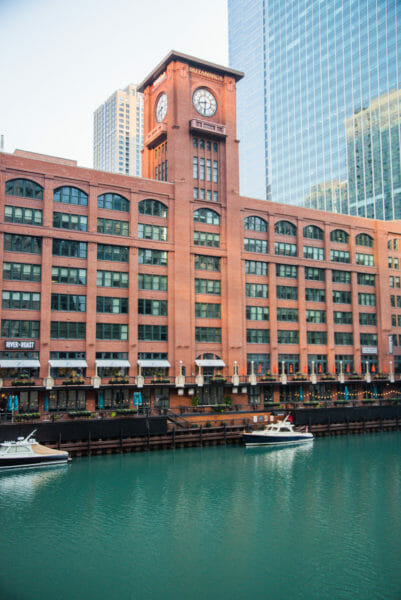 Brick clock tower on the river in Chicago