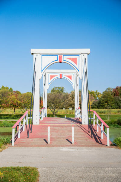 White footbridge in Windmill Island Gardens