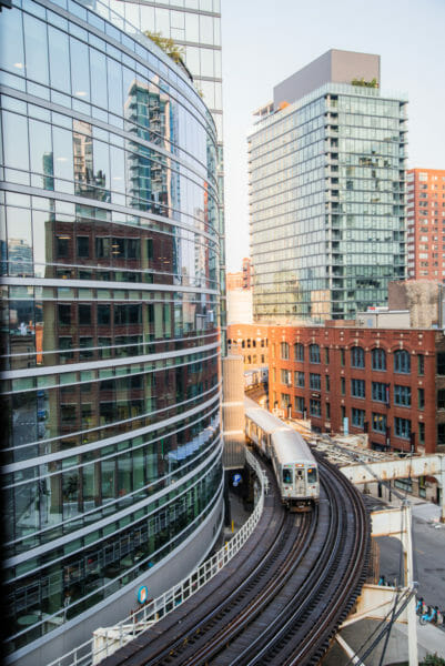 Train curving around a building in Chicago