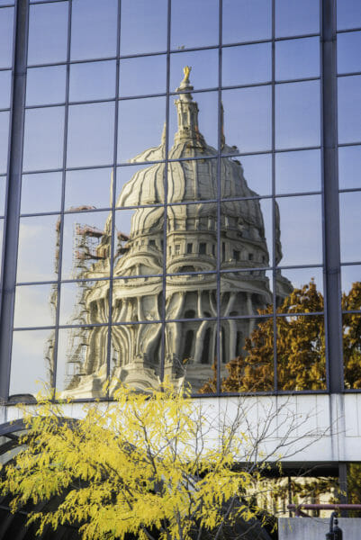 Reflection of Capitol building in Madison in windows