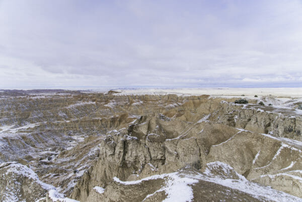 Rock mounds in Badlands National Park with snow