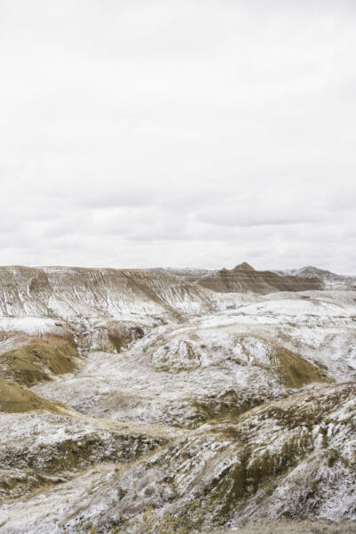 Hills in Badlands National Park covered in snow