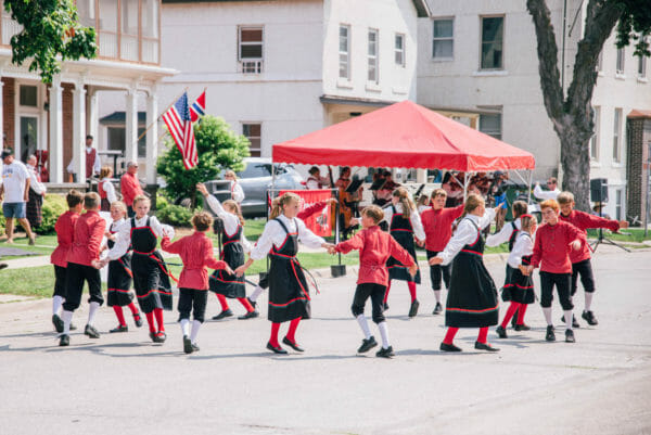 Children dancing in traditional Norwegian outfits