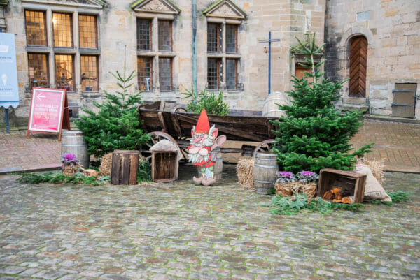 Troll with Christmas trees outside of Kronborg